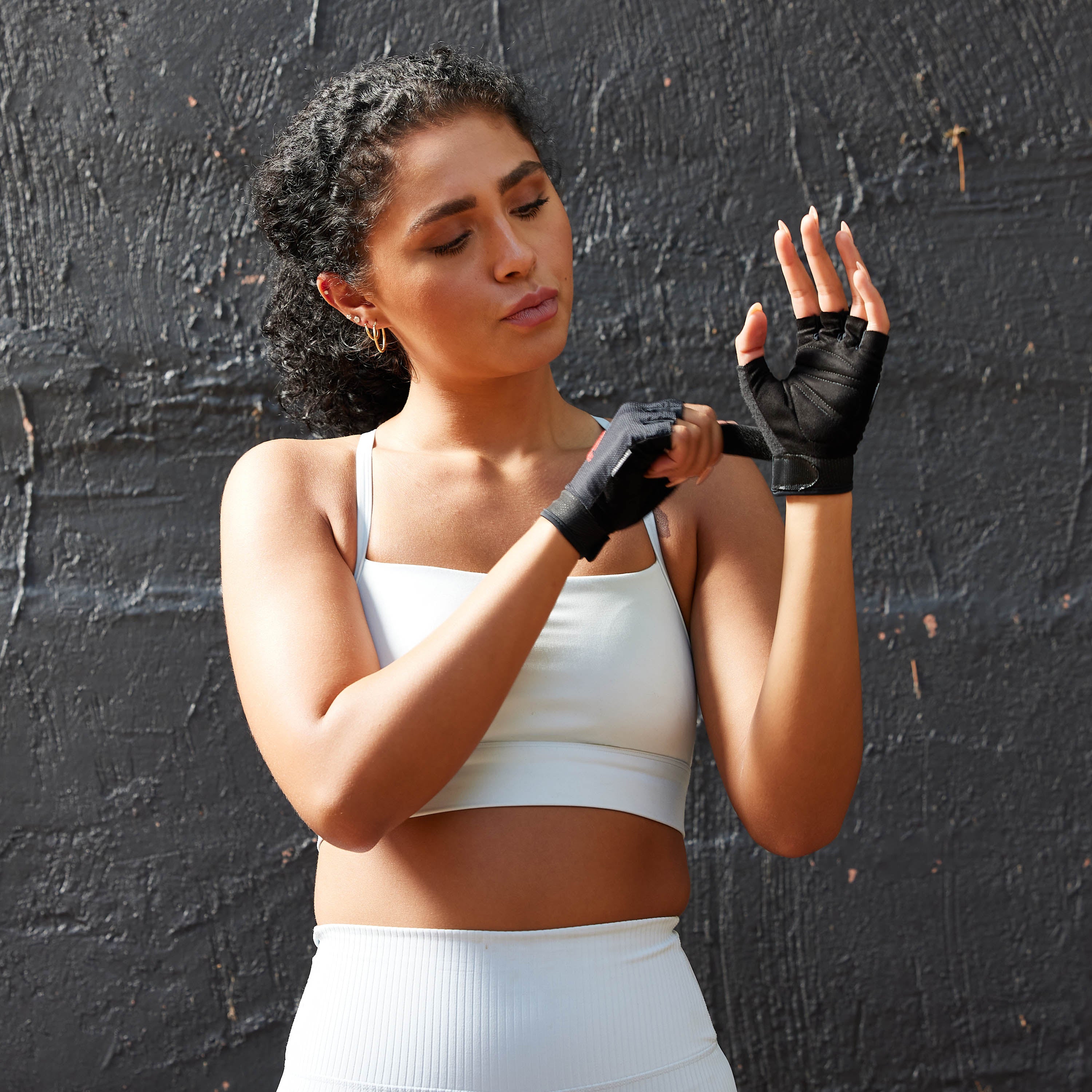 Essential Adjustable Gloves on hands showing the hook and loop closure